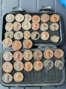 "Ancient Fortune Unearthed: Metal Detectorist Stumbles Upon Hidden Treasure of 1,800-Year-Old Roman Coins in English Field!"