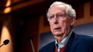 "Mitch McConnell's Unraveling Strategy: Is His Stumble a Defiant Stand Against America's Darkest Hour?"