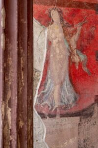 "Unearthing Extravagance: Pompeii's Hidden Banquet Hall Reveals Vibrant Frescoes of Ancient Rituals—What Secrets Lie Beneath the Paint?"