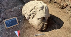 Ancient Rome’s Secrets Unveiled: Mysterious Giant Statue Head Discovered Near Trajan’s Forum!
