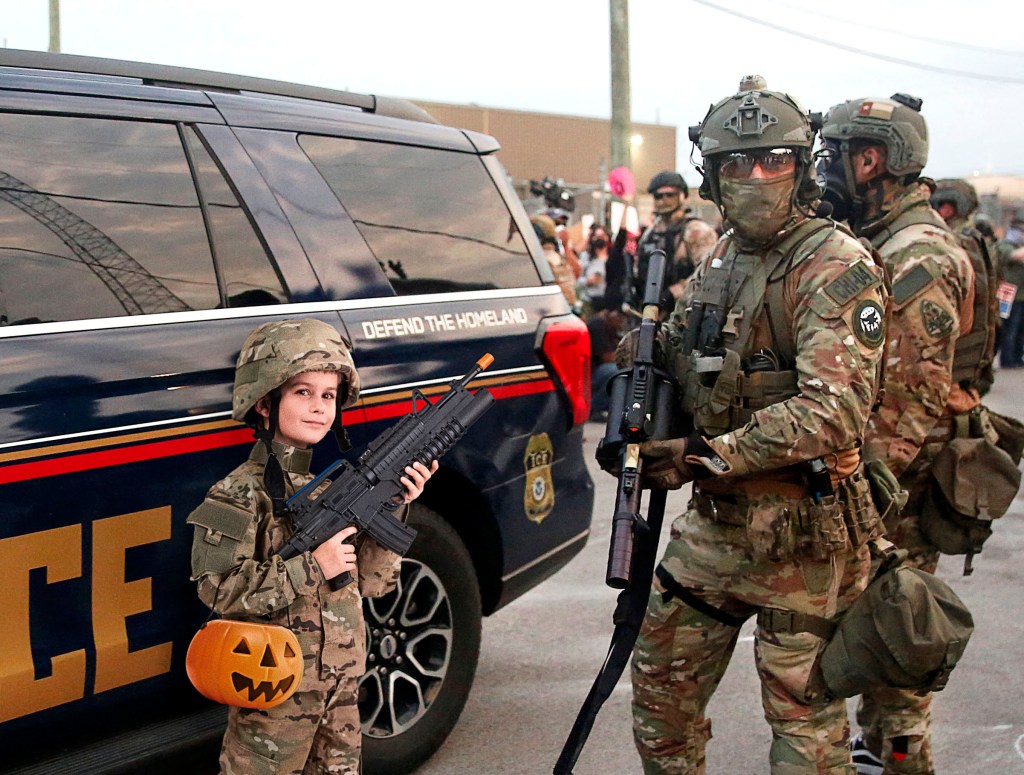 Unlikely Twins: ICE Agent and Child Strikingly Alike in Matching ‘Military Commando’ Halloween Disguise