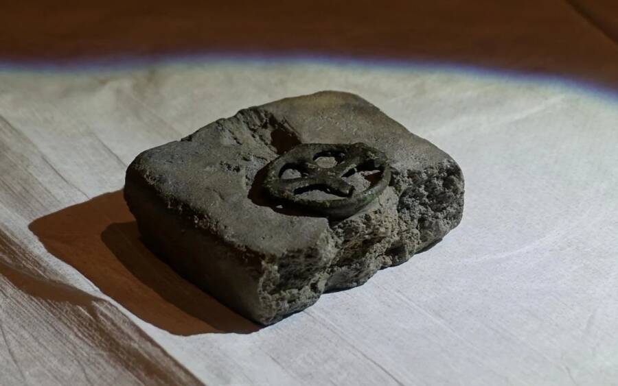 Ancient Mystery Unveiled: Metal Detectorist Discovers 1,000-Year-Old Cross Depicting Jesus Enigmatically Encircled by a Wheel