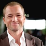 Taron Egerton Spills on the Unplanned On-Set Kiss That Stunned Tom Hardy