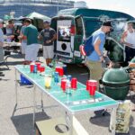 What’s Really Happening at That Mysterious Tailgate Across the Lot?