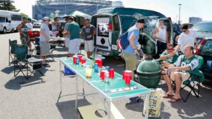 What’s Really Happening at That Mysterious Tailgate Across the Lot?